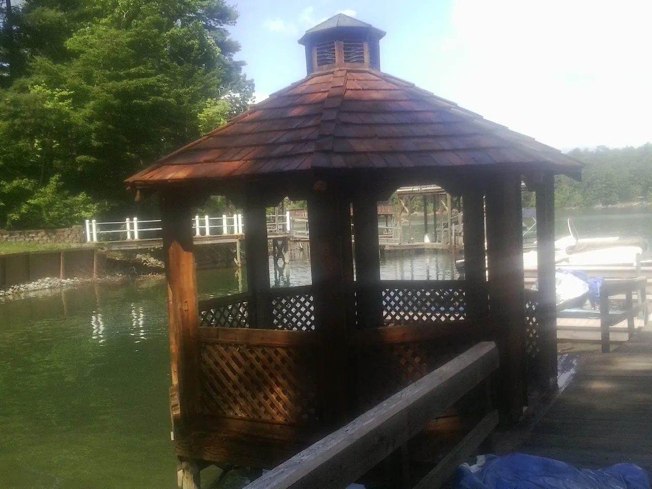 Cedar shake gazebo roof rebuilt on a lake dock in Glenside